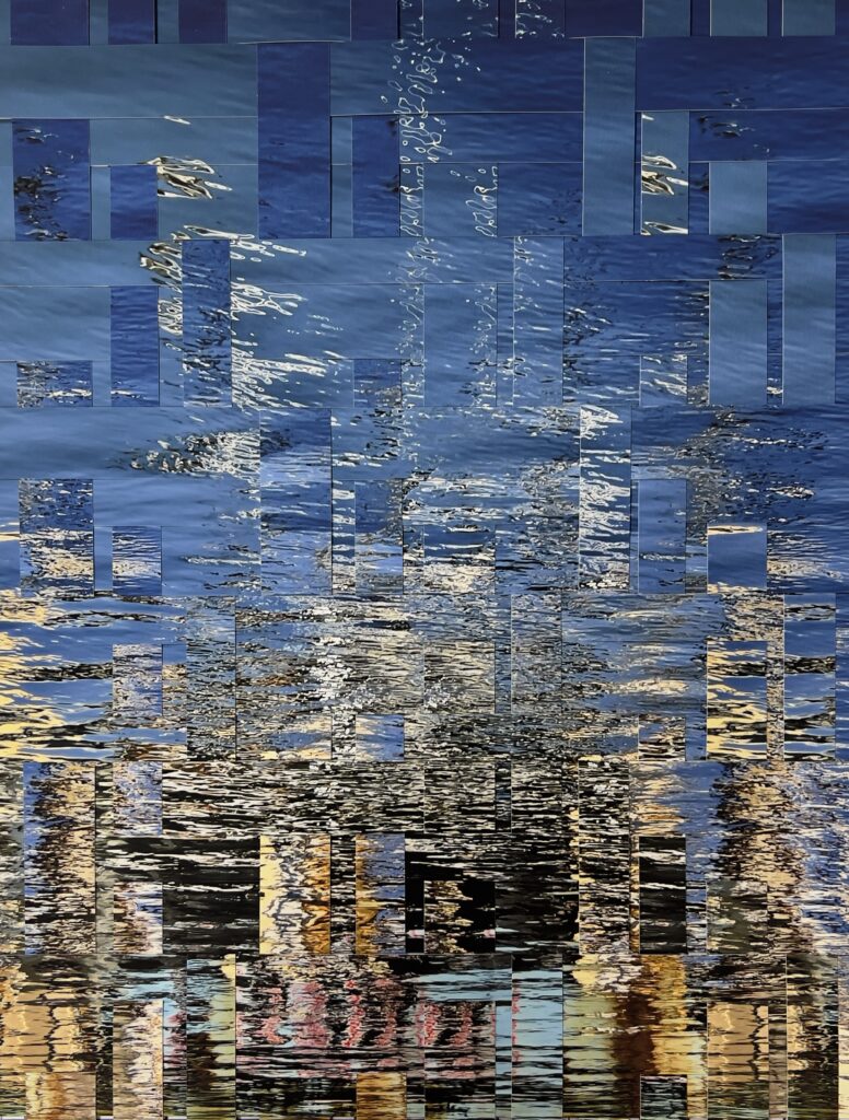woven photograph of an abstract water view with blue at the top and gradation of greens at the bottom
