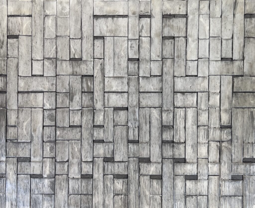 abstract woven photograph with gradations of whites, greys and blacks.