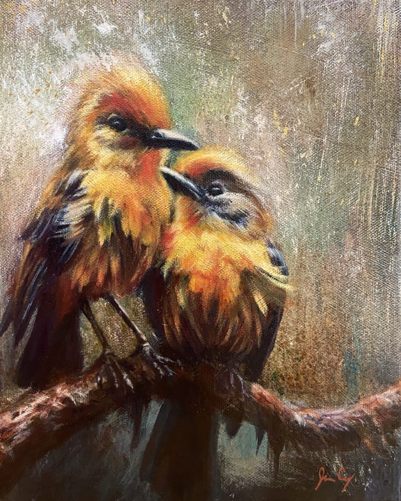 Painting o two yellow and orange birds perched on a branch looking at each other.