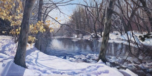 Realistic winter oil on canvas painting by Charlene Lavinia with a creek in central area of painting with snow on the banks in foreground and background. Tree trunks are brownish grey and frame the scene. A light blue sky is featured going from the center left to the top left and middle of painting. Light shines on the creek from the left creating shadows of the trees on the water.