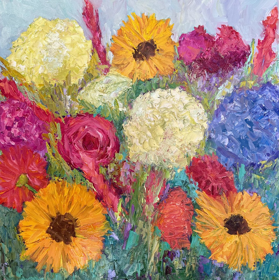 Multiple orange, red, yellow and lavender painted flowers.
