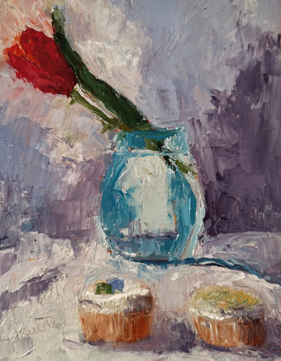 Oil painting of tulips with cupcakes in front of them.